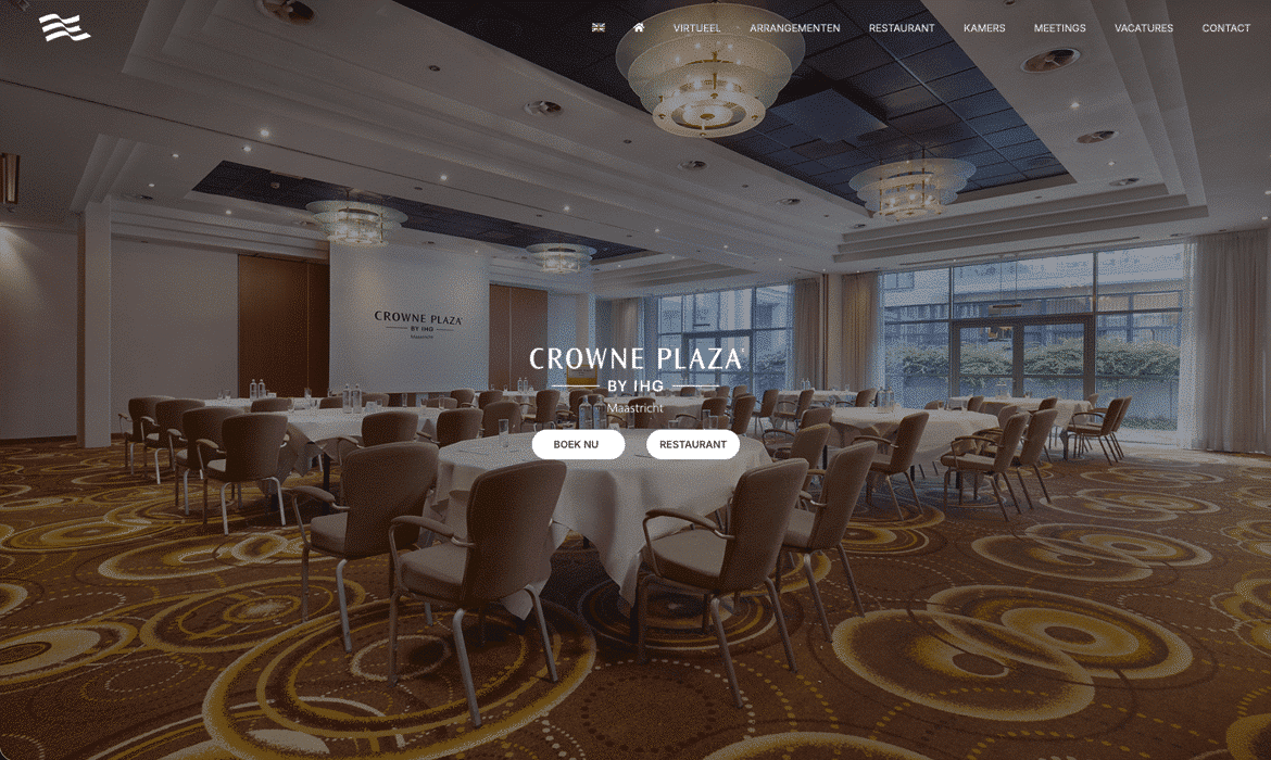 Banquet hall at Crowne Plaza Maastricht with round tables and soft lighting, ready for a corporate event.